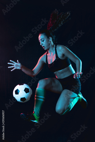 Full shot fit woman playing football