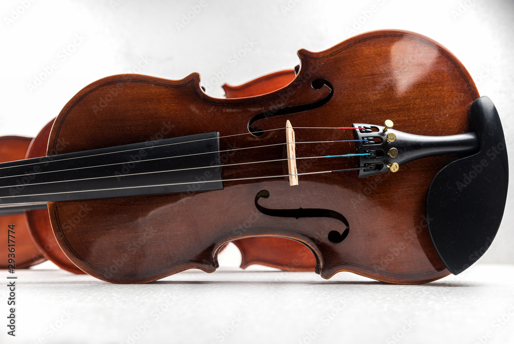 Violin and viola put on white background,During the practice break time to prepare For the concert. Violin and viola put on white background,During the practice break time to prepare For the concert.