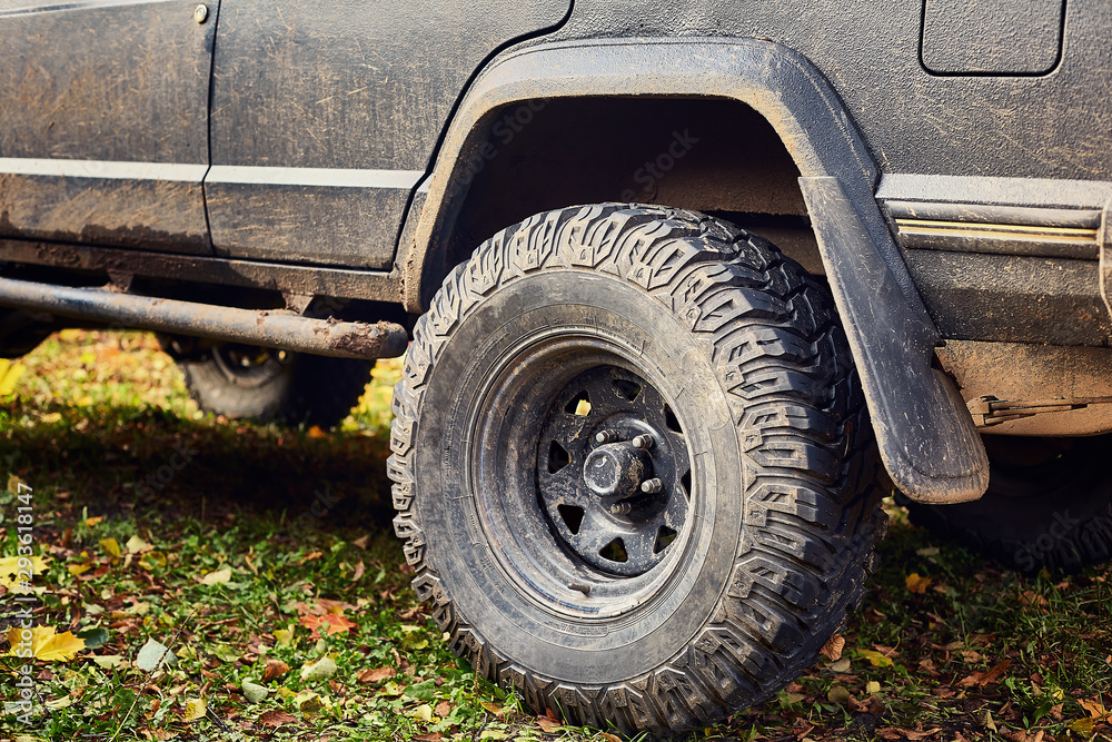 dirty back wheel of the jeep close-up dirty back wheel of the jeep close-up