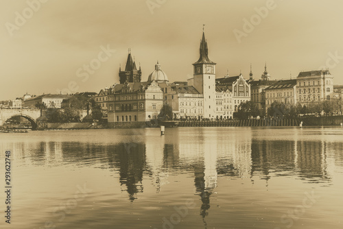 Prague Old Town on the banks of Vltava river  scenic cityscape with reflection in the water  Czech Republic. Old vintage film style image