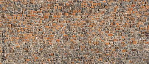 Old red brick stone wall vintage background 