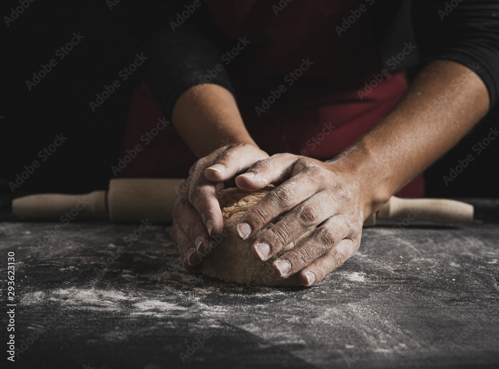 Close-up baker hands kneading dough Close-up baker hands kneading dough