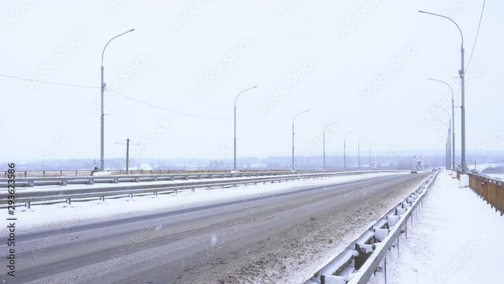 Snowy slippery road in winter weather. Snowing, background