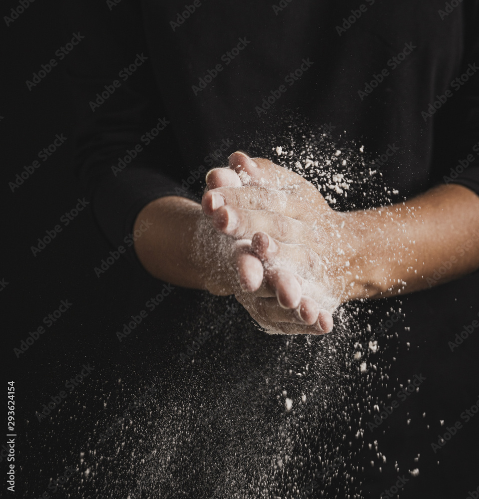 Fototapeta premium Close-up baker hands full of flour
