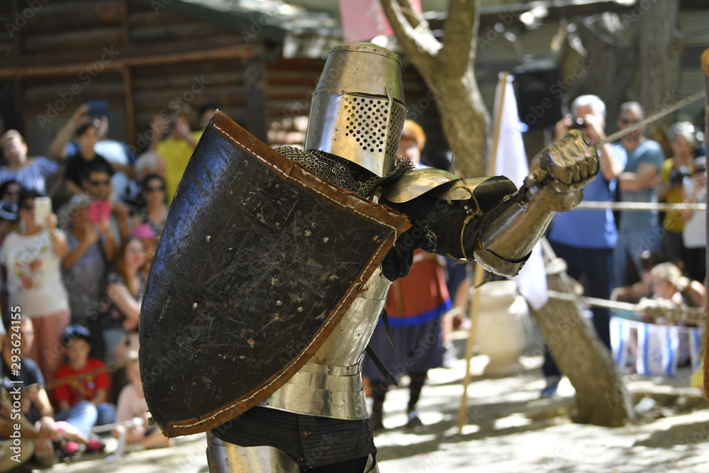 Knights are fighting on the battlefield during the festival 