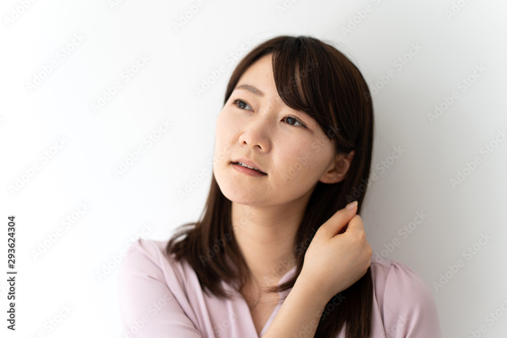 Business woman massaging her neck against white background Business woman massaging her neck against white background