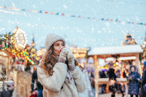 Girl walking on Christmas Market on Red Square in Moscow photo