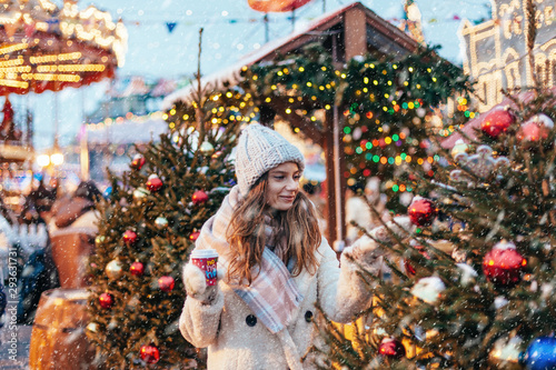 Photography Girl walking on Christmas Market on Red Square in Moscow