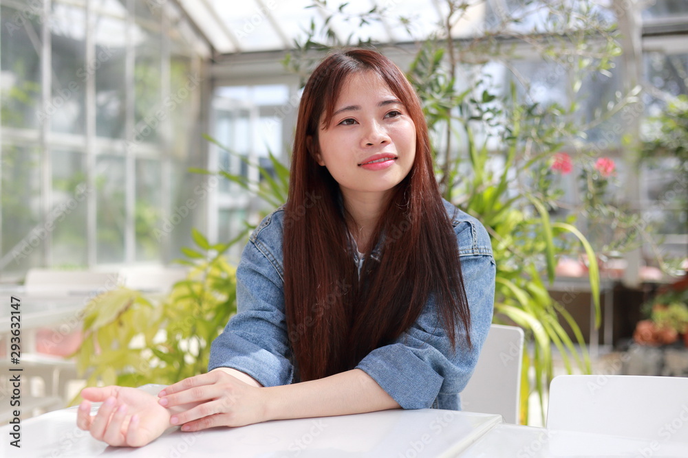 portrait of young woman at botanical garden in japan portrait of young woman at botanical garden in japan