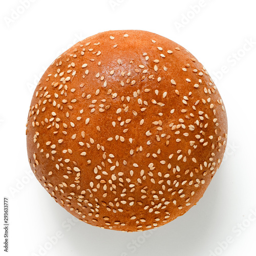 Sesame seed hamburger bun isolated on white. Top view.