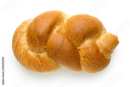 Plaited plain white bread roll isolated on white. Top view.