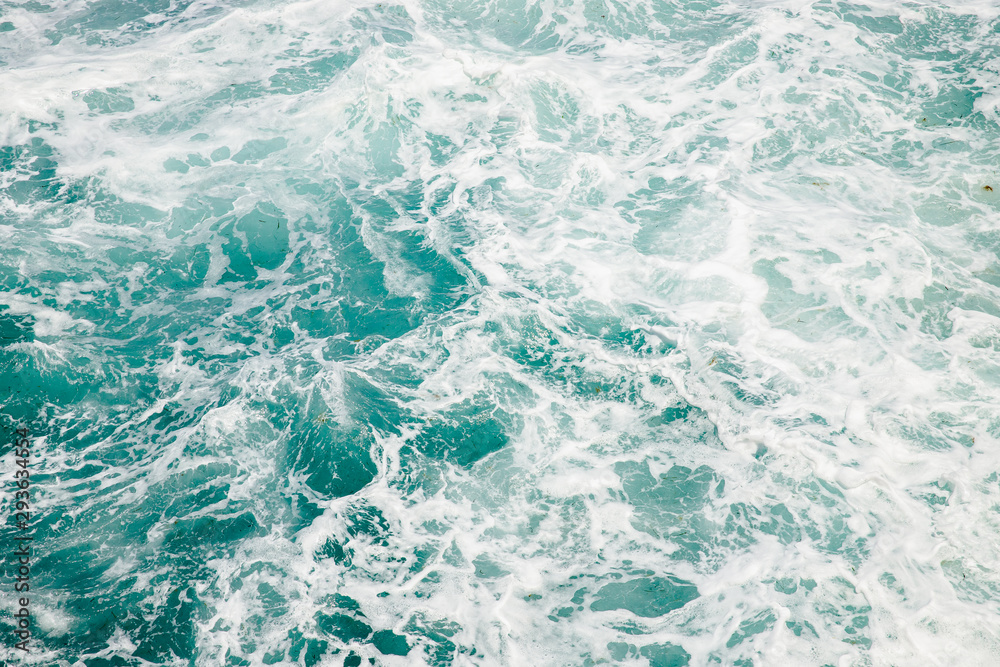 Natural background storm sea blue ocean with foam and waves Natural background storm sea blue ocean with foam and waves