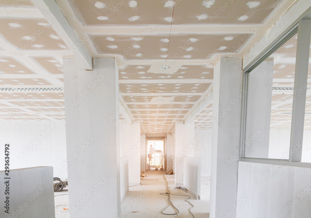 gypsum board ceiling structure and plaster mortar wall painted foundation white decorate interior room in building construction site - obrazy, fototapety, plakaty 