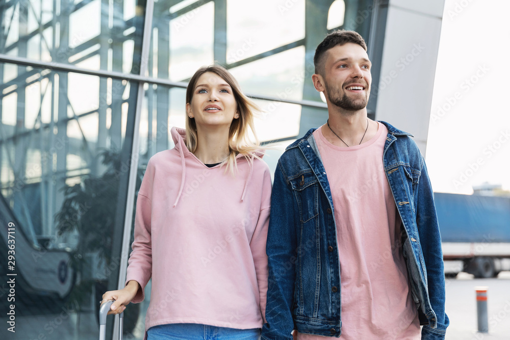 Couple At Airport. Happy Young People Traveling Together Couple At Airport. Happy Young People Traveling Together