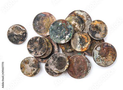 Old rusted coins,Oxidized old coins on white background.