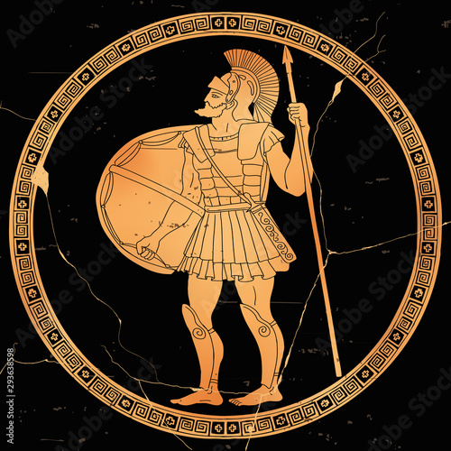 Ancient Greek warrior with a spear and shield in his hands is ready to attack.