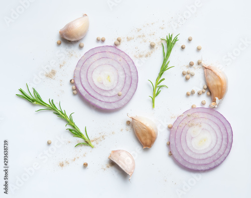 Red onion, garlic,rosemary and pepper on a white background