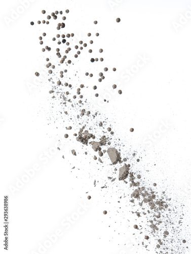 White pepper and heap of powder splash or explosion flying in the air isolated on white,Stop motion