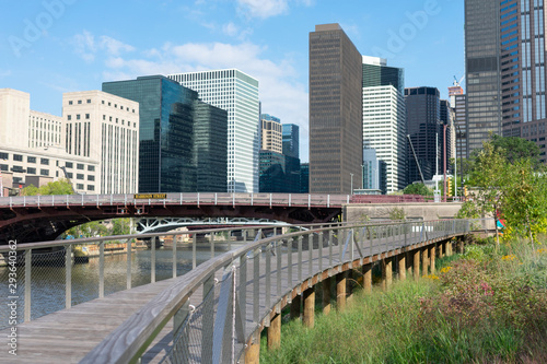 The Riverwalk along the South Branch of the Chicago River in Downtown Chicago with Skyscrapers