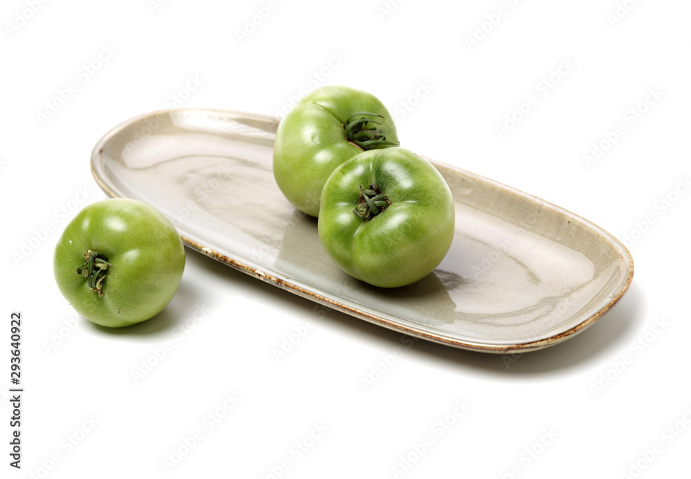 fresh green tomato isolated on white background