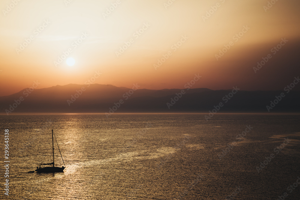 sunset on the sea with a boat in Cabo de Gata