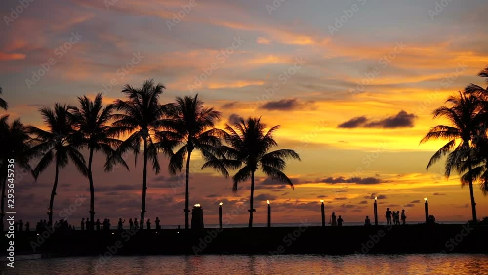 Silhouettes of people and coconut tree during sunset in Kota Kinabalu, Sabah Borneo, Malaysia.
