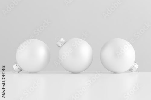 Three white matte christmas balls.