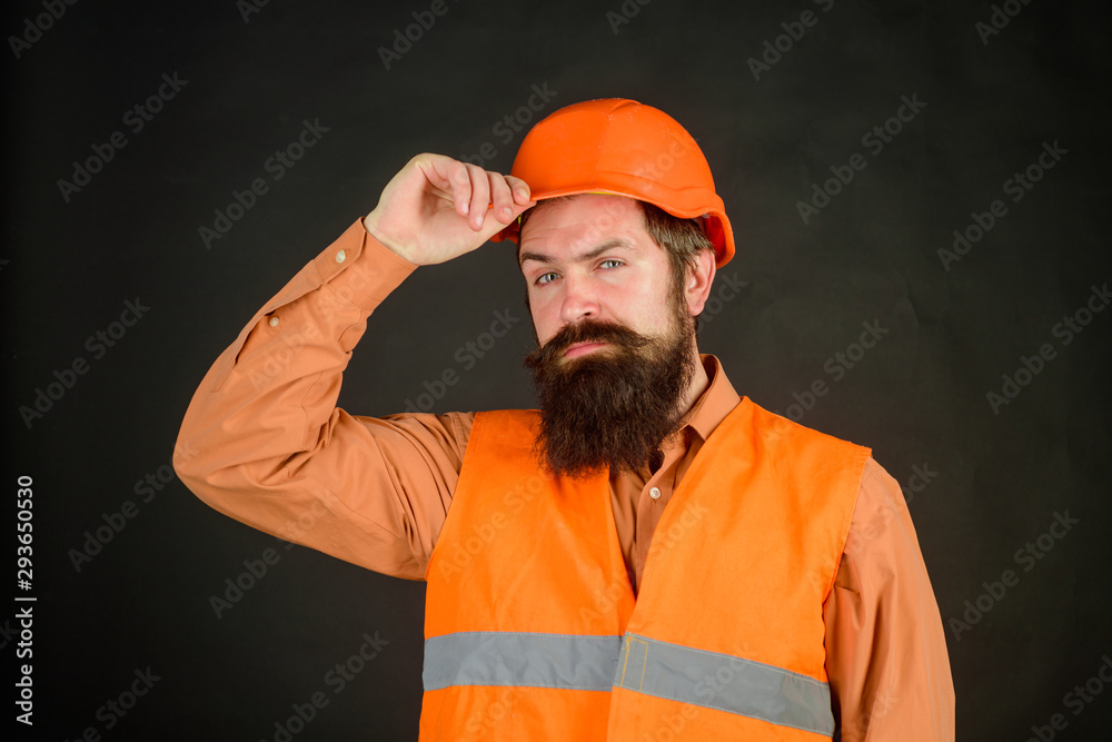 Business, building, industry, technology. Builder in hard hat. Man builder. Bearded man in overalls and construction helmet. Mechanical worker. Industrial worker. Construction worker in hardhat. Business, building, industry, technology. Builder in hard hat. Man builder. Bearded man in overalls and construction helmet. Mechanical worker. Industrial worker. Construction worker in hardhat.