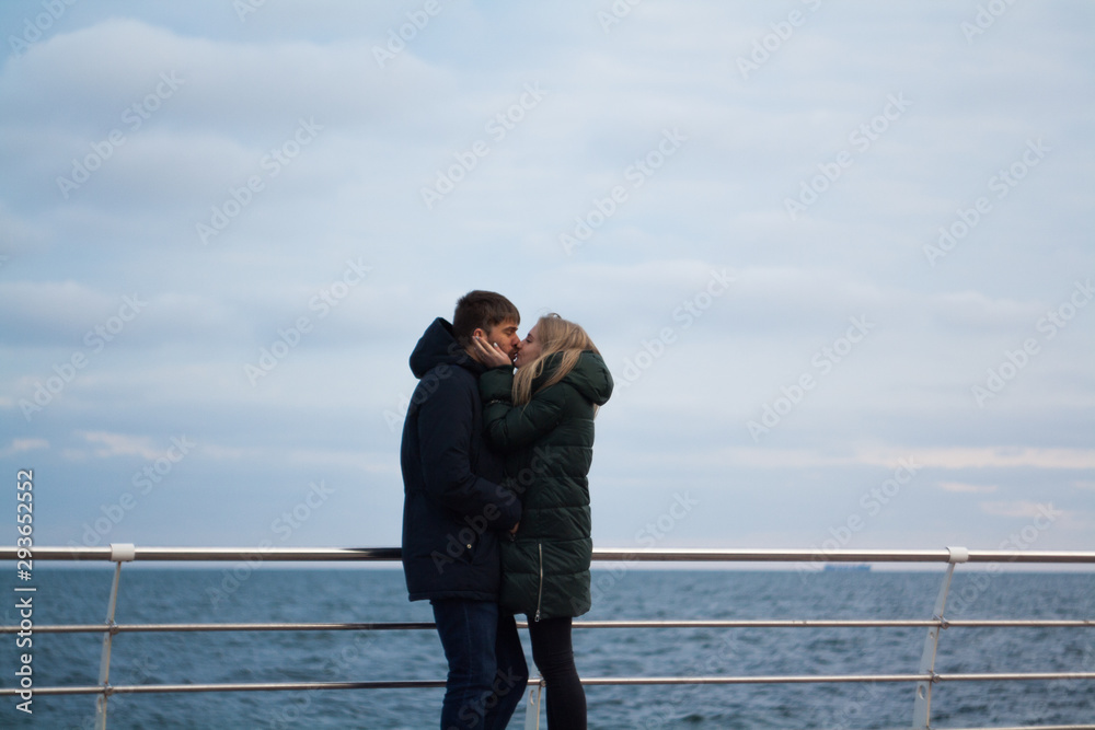 winter love story. couple in the sea