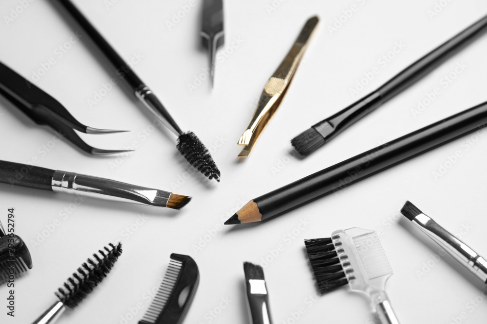 Set of professional eyebrow tools on white background Set of professional eyebrow tools on white background