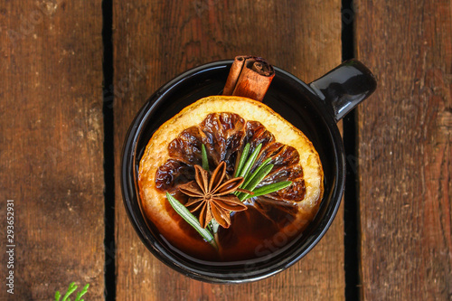 Christmas mulled wine on a wooden table. Traditional hot drink at Christmas (red wine with spices, New Year's Eve, Noel holiday festive) x-mas flat lay. food background. copy space. Top viev