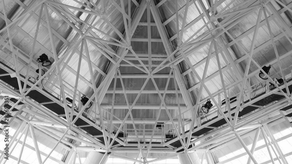 Structure of steel roof frame for building construction. Roof trusses design indoors