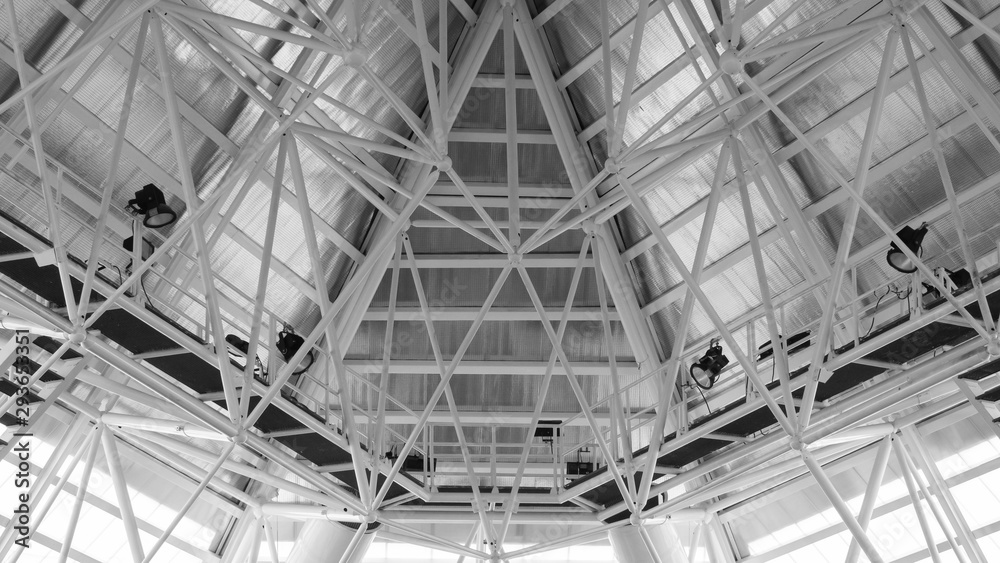 Structure of steel roof frame for building construction. Roof trusses design indoors Structure of steel roof frame for building construction. Roof trusses design indoors