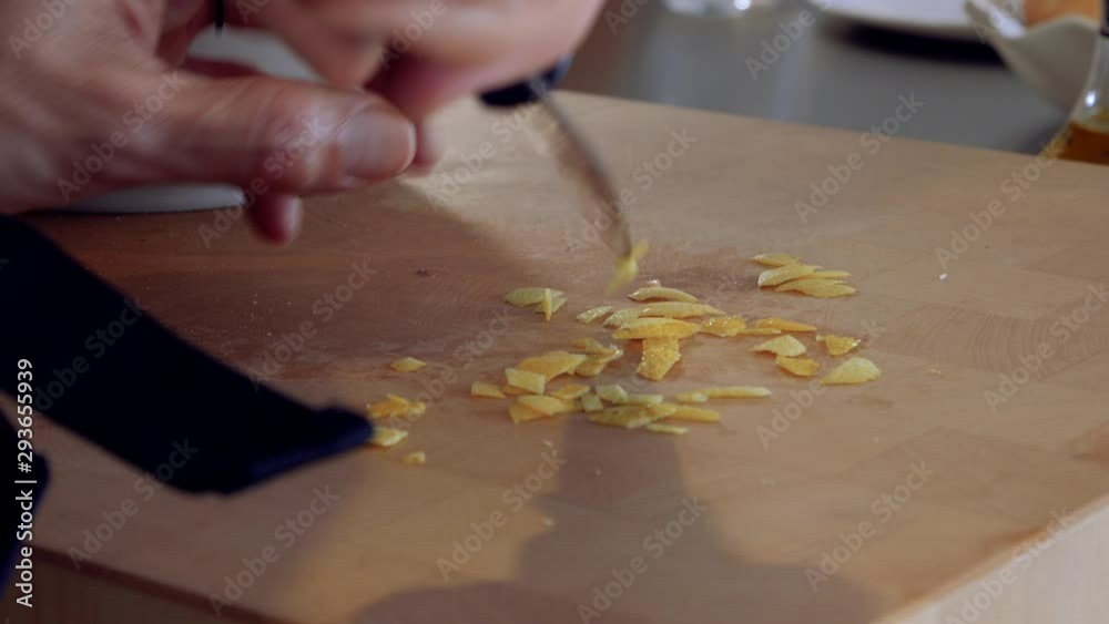 kitchen.hand cutting lemon with a knife. cooking kitchen.hand cutting lemon with a knife. cooking