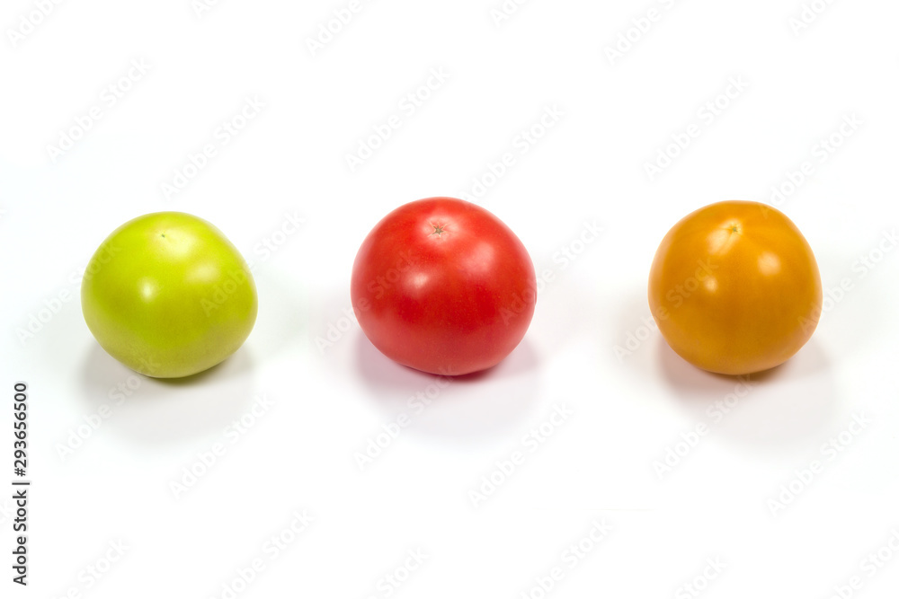 Tomatoes on a white background different degree of maturation Tomatoes on a white background different degree of maturation