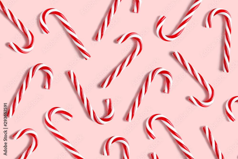 Candy cane for party design on pink background.