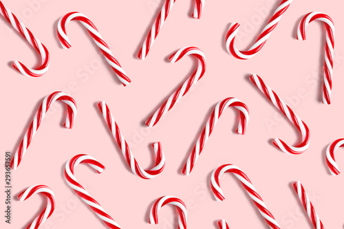 Candy cane for party design on pink background. photo