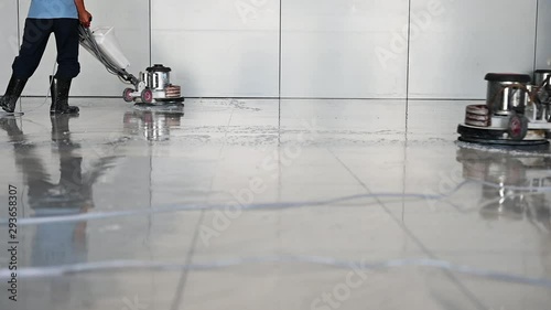 Labor cleaning the floor with cleaning machine - Slow motion