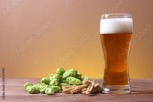 Beer, wheat and hops on the table.