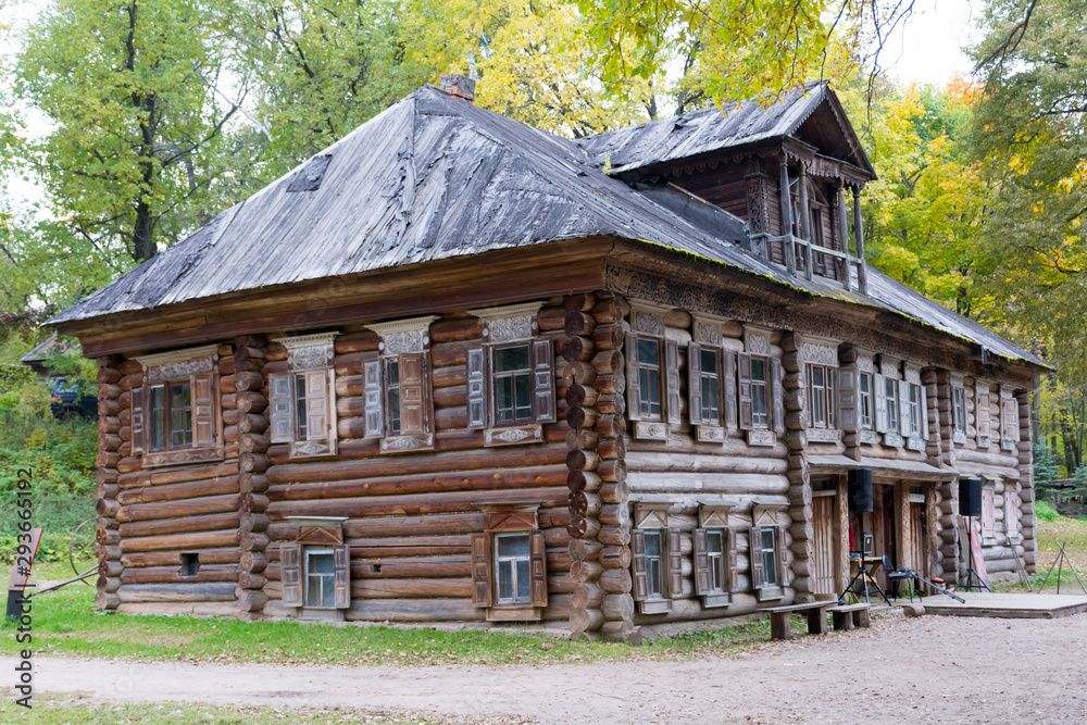 wooden two-storey house in the forest