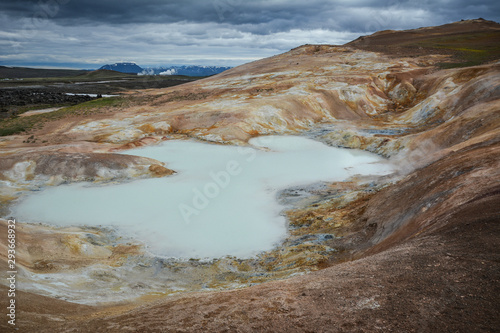 Leirhnjukur, Krafla fires in Iceland, blue water on clay hill, overcast day in summer, film effect with grain