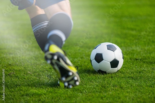 Running soccer player. Soccer football background. © BillionPhotos.com