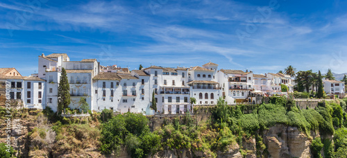 Panorama of white houses at the canyon in historic city Ronda, Spain