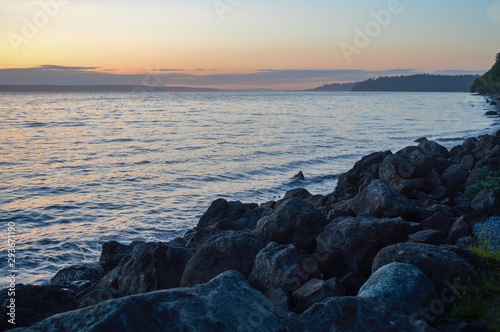 coastline seawall made of large stacked boulders © Taya