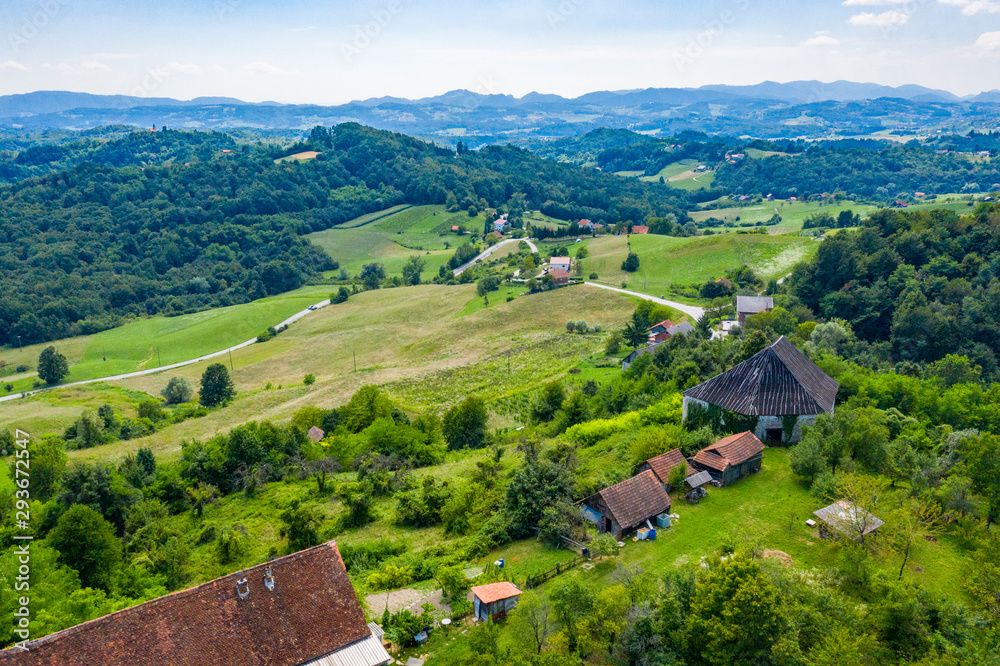 Aerial view of green hills and nature in Zagorje, northern Croatia on sunny summer day