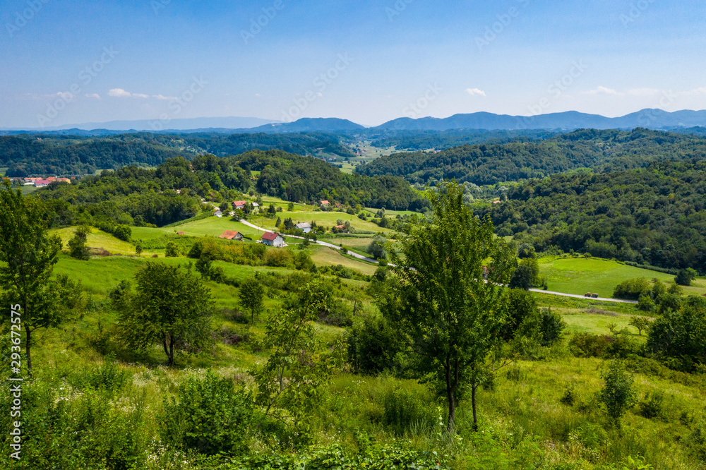 Fototapeta premium Aerial view of green hills and nature in Zagorje, northern Croatia on sunny summer day