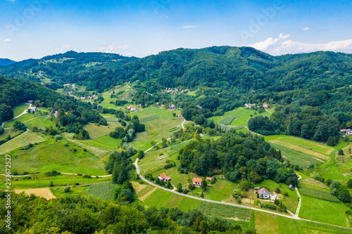Aerial view of green hills and nature in Zagorje, northern Croatia on sunny summer day