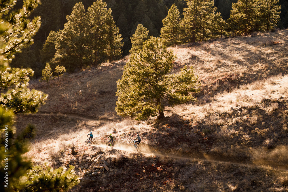 Three mountain bikers on Hardscrabble trail in the Apex Open Space park in Golden, Colorado. Three mountain bikers on Hardscrabble trail in the Apex Open Space park in Golden, Colorado.