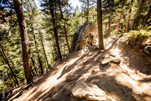 One man mountain biking on Lair O' the Bear trail in Morrison, Colorado.