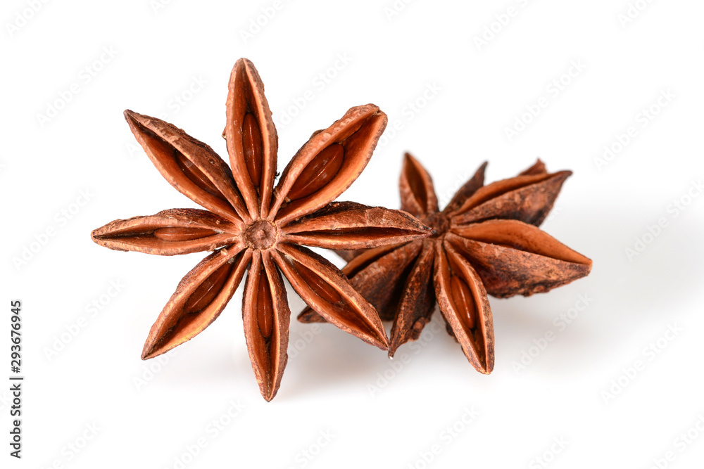 Star anise spice. Two dry star anise fruits isolated on white background with shadow. Macro close-up top view of illicium verum or chinese badiane. Star anise spice. Two dry star anise fruits isolated on white background with shadow. Macro close-up top view of illicium verum or chinese badiane.